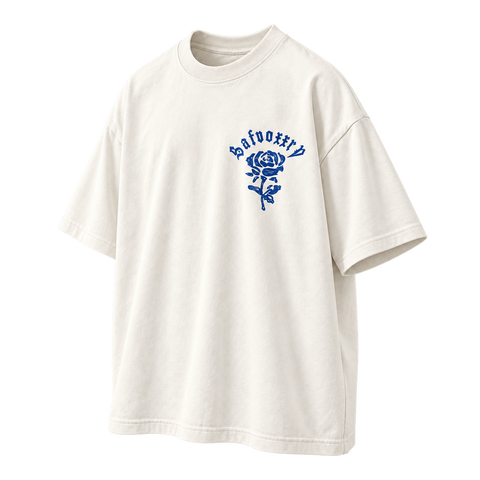 Gothic Rose Oversized Graphic Tee white colorway, three-quarter angled front view with blue rose chest print